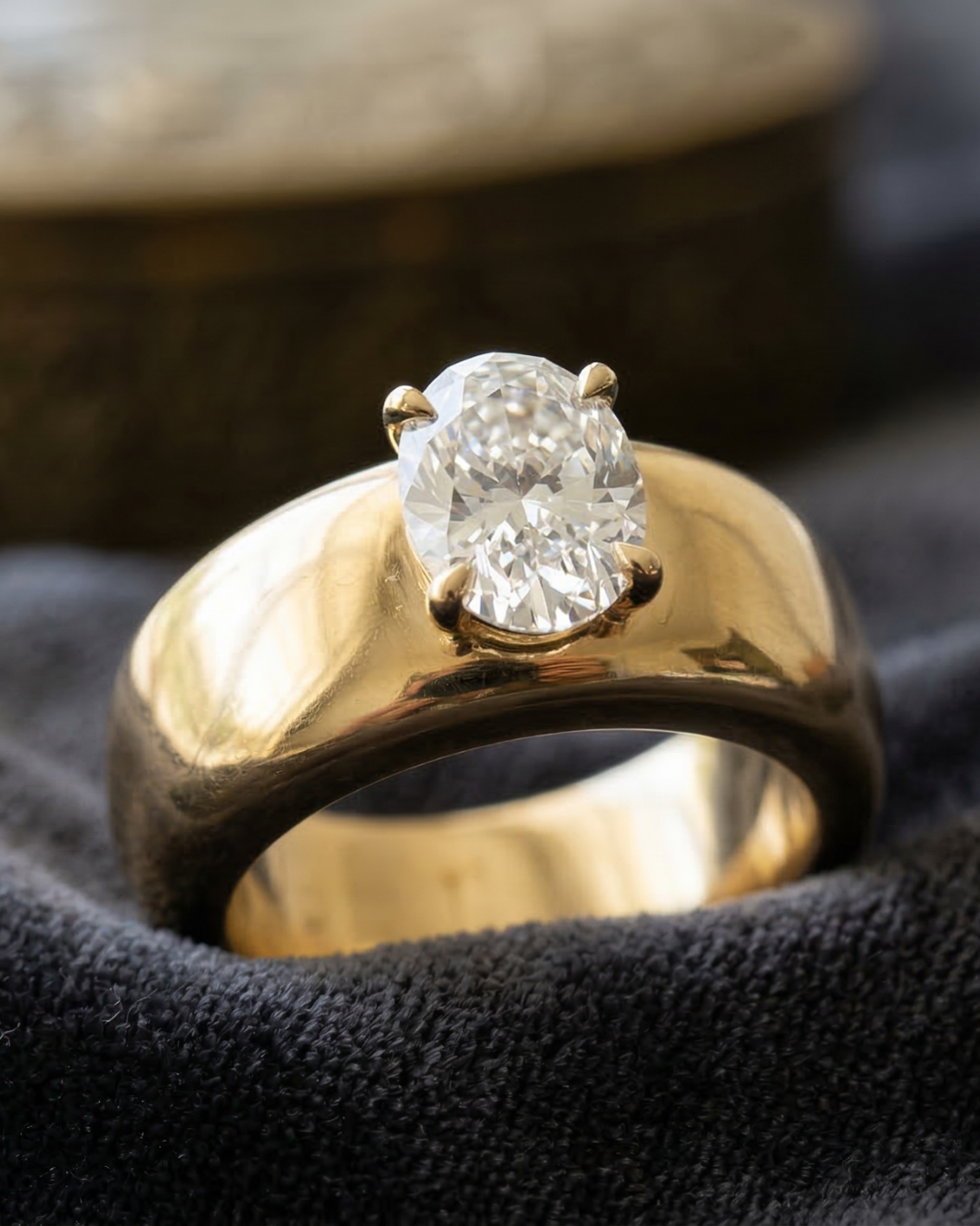 A wide, polished 14k yellow gold Amorati cigar band engagement ring featuring a 3-carat radiant cut lab-grown diamond in a flush setting.