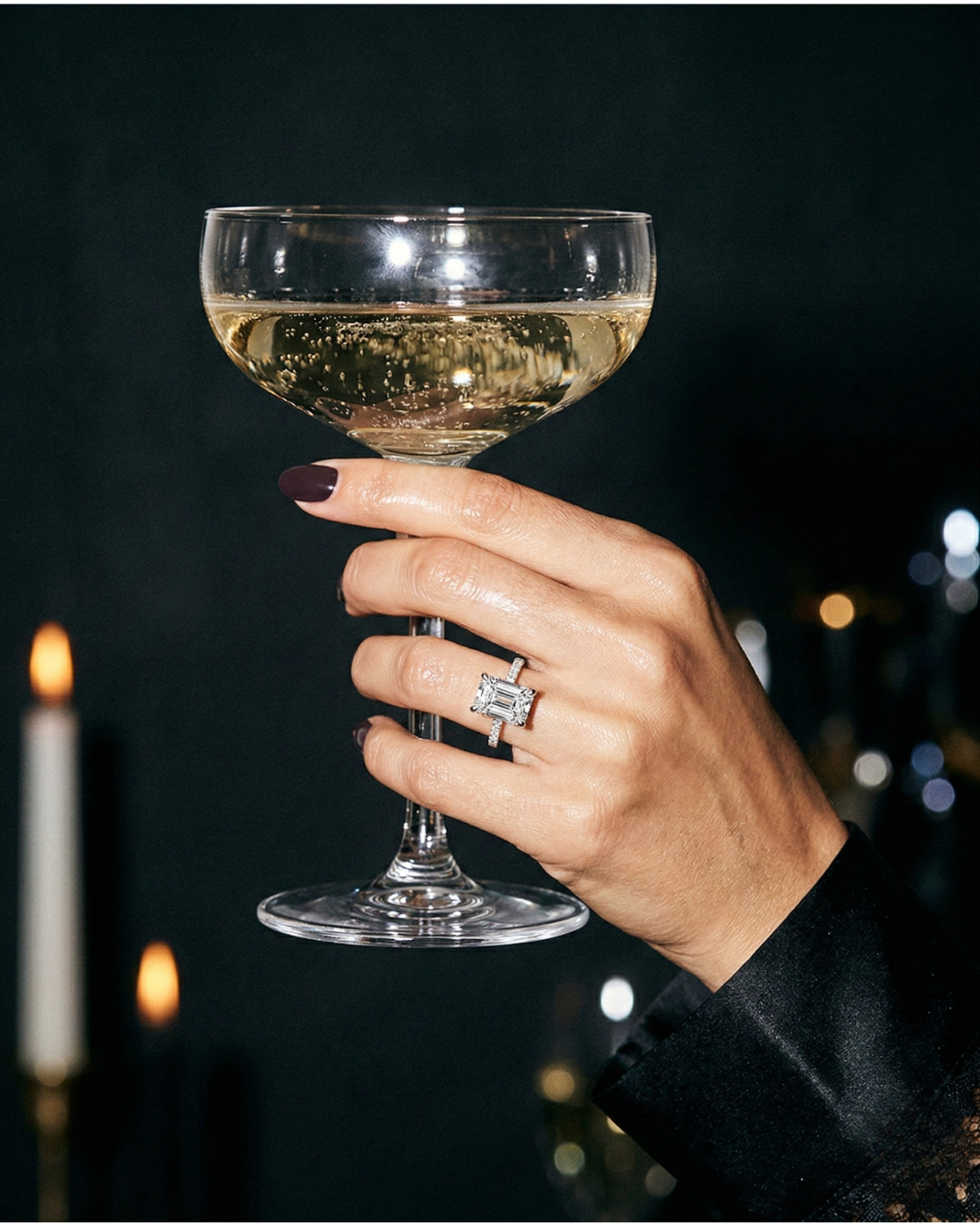 An elegant emerald cut diamond engagement ring by Amorati, showcasing a sophisticated, quiet luxury aesthetic.